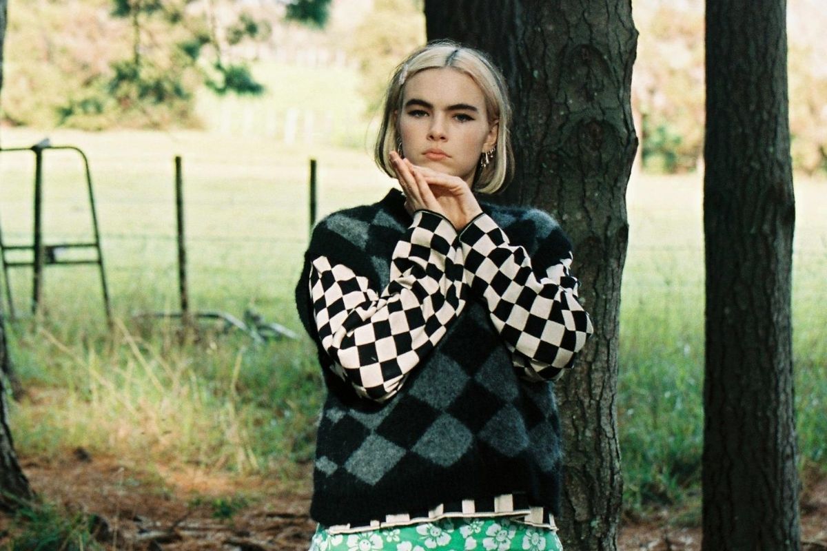 benee 2020 press shot in woods with checkered shirt