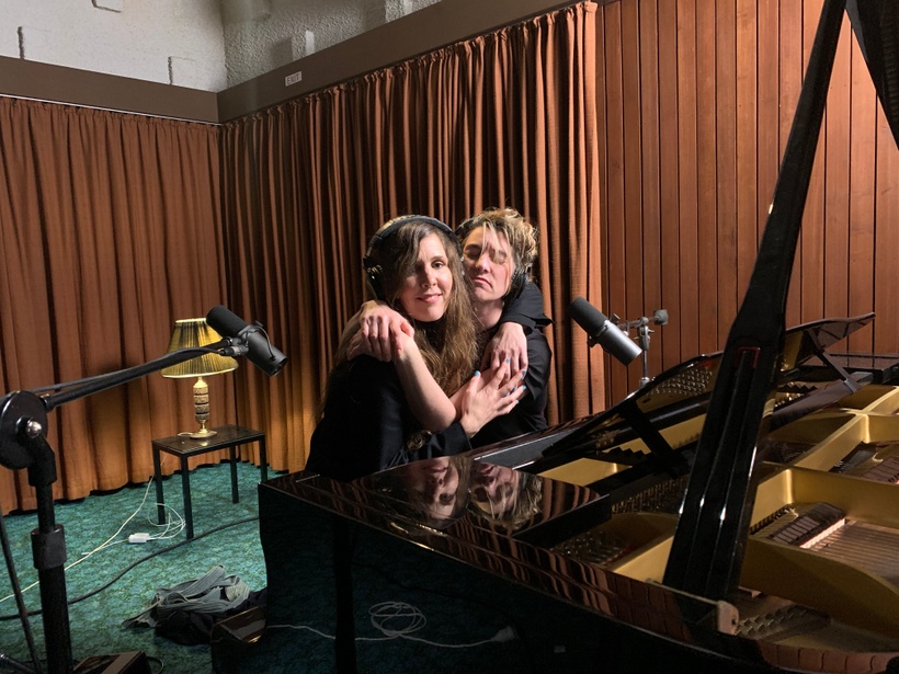 Fountain and Palmer hugging following the recording of their performance.
