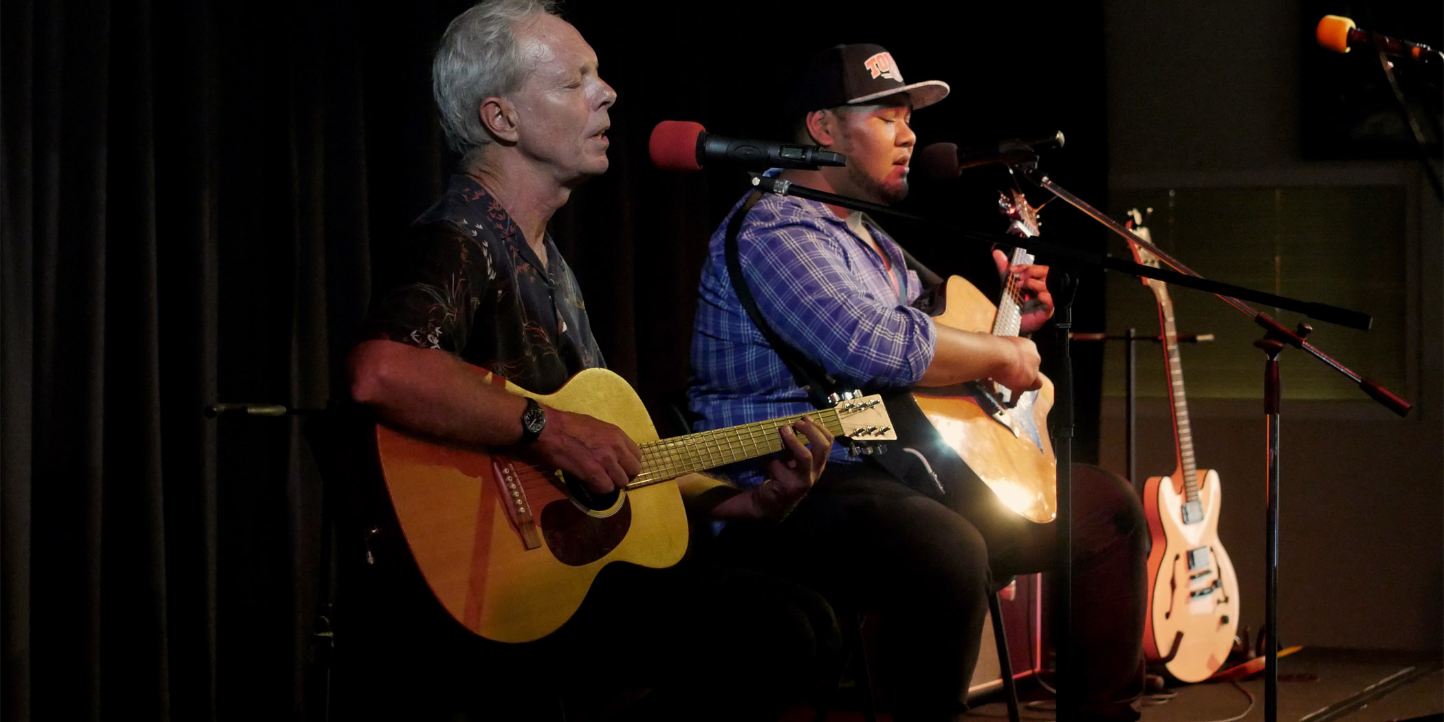 Murray (left) performing with Anthony from Songbirds 1 at the Redfern Community